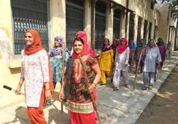 Women Sarpanch Sunita leading other womenfolks