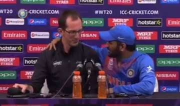 Sam Ferris shares stage with M S Dhoni at the post-match presser