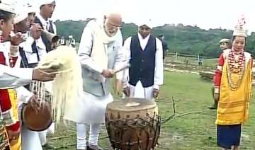 PM Modi tries his hands at drums in Meghalaya
