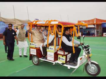 PM Modi riding an E-rickshaw