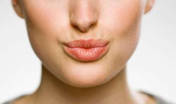Love pouting? These 5 tips will protect your lips from summer tan