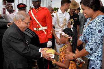 President Pranab Mukherjee greets a girl child on his arrival in Accra, Ghana
