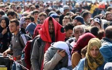 Migrants and refugees waiting for buses