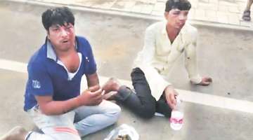 Video grab of the two men being ‘punished’ by gau rakshaks.