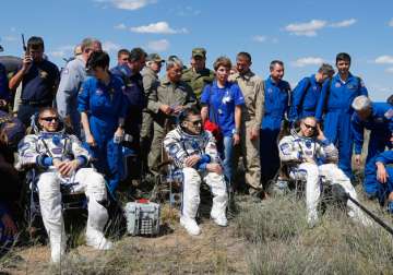 Three International Space Station astronauts land in Kazakhstan