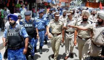 Rapid Action Force (RAF) personnel take out flag march in Amritsar 