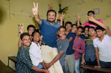 Super 30 founder-director Anand Kumar with successful students 