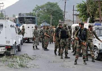 Security jawans stand guard after Pampore attack