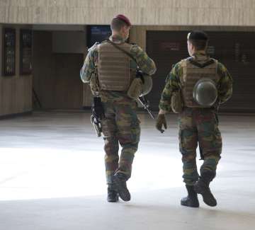 Belgian soldiers patrol at Brussels Central train station on June 19