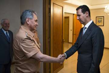 Syrian President Bashar Assad with Russian Defense Minister Sergei Shoigu 