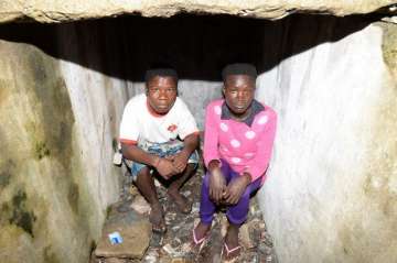 Child prostitutes in Liberia sleep in graves to stay alive 