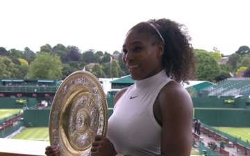 Serena Williams holding the shield
