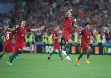 Portugal's players celebrate win against Poland in Euro 2016 quarterfinal