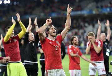 Wales players celebrate after beating Belgium in Euro 2016 quarterfinal