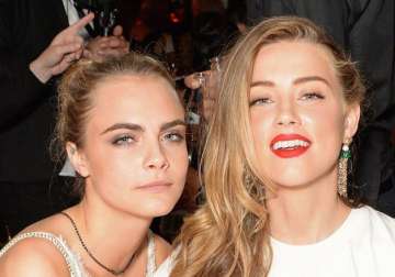 Cara Delevingne and Amber Heard 