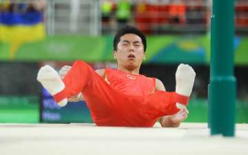 Chinese gymnast You Hao after falling during the men’s parallel bars final 
