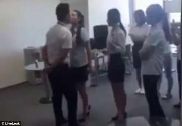 Watch video Boss passes pen mouth-to-mouth to female employees - IndiaTV