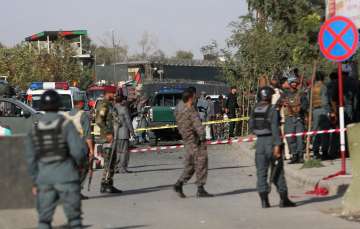 Police inspect at the site of suicide attack near Afghan Defence Ministry