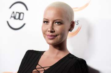 Amber Rose poses topless