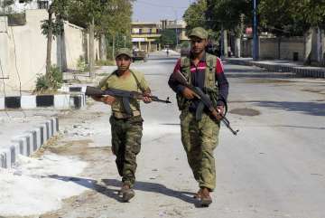 FILE: Free Syrian Army fighters patrol in Jarablus, Syria