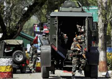 Army personnel in action inside Army Brigade camp during a terror attack in Uri