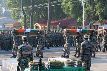 Army jawans carrying the coffins of their colleagues killed in Uri attack