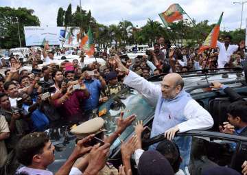 BJP President Amit Shah being welcomed on his arrival at Kozhikode airport