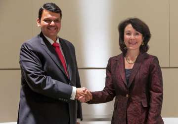 Oracle CEO Safra Catz shakes hands with Devendra Fadnavis