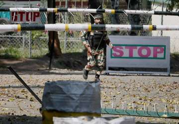 An army soldier in action inside Army Brigade camp during terror attack in Uri