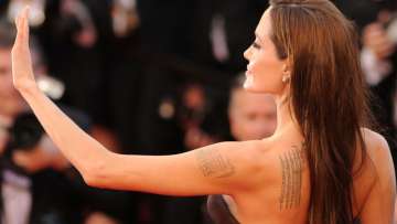 Angelina wants to remove all tattoos related to Brad from her body