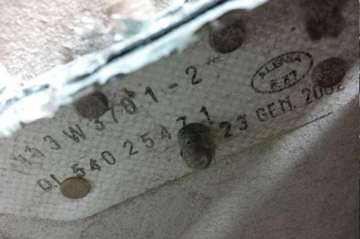 a serial number is seen on a piece of aircraft debris at the ATSB laboratory