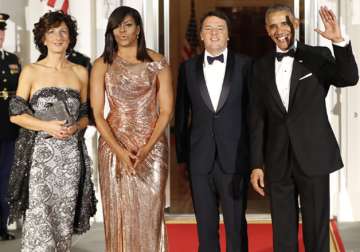Barack Obama, Michelle Obama greet Matteo Renzi and his wife Agnese Landini.