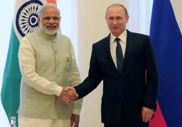 File pic - Vladimir Putin shakes hands with Narendra Modi during SCO Summit.