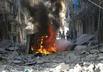 Syrian Civil Defense group inspect damaged buildings after airstrikes 