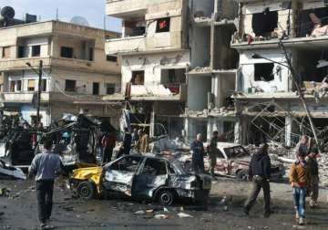 File pic - Syrian citizens at the scene where two blasts exploded in Zahraa