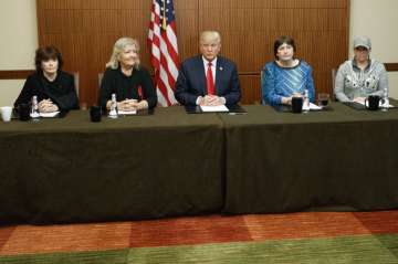 Trump sits with, from right, Paula Jones, Kathy Shelton, Juanita Broaddr