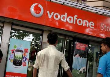File pic - People outside Vodafone store in Delhi