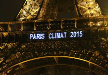 File pic - The Eiffel tower lit up during the Paris climate talks in 2015.

