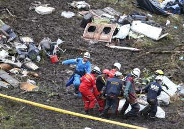 Rescue workers at the site of an airplane crash in La Union