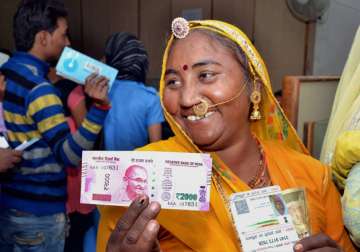  A rural woman senior citizen after exchanging Rs 500 and 1000 notes in Beawar