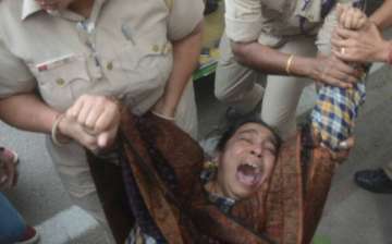 Delhi Police detain missing JNU student's mother.