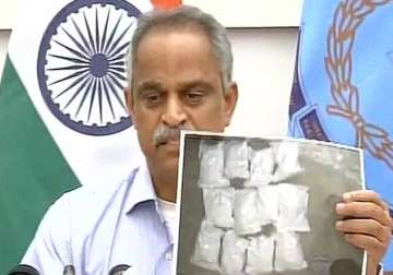 A DRI official speaks to media after busting the drug racket 