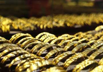 File pic - Gold bangles put on display at a jewellery shop 
