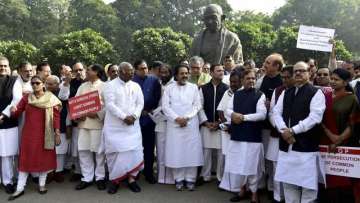 MPs protest outside Parliament on Wednesday over the demonetisation
