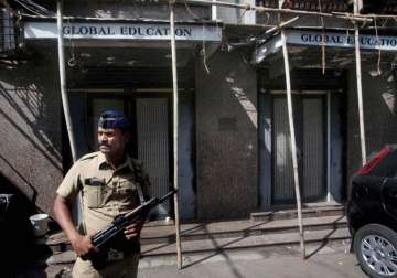 A police man stand gurad during NIA raid at IRF of Zakir Naik in Mumbai