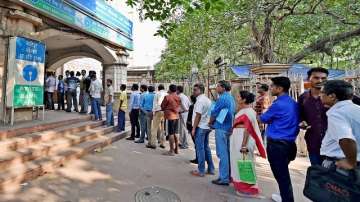 People standing in queue to exchange notes