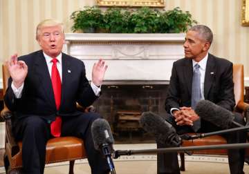 Barack Obama and Donald Trump speak to media at the Oval Office. 