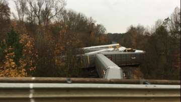 Train derails BMW damaged