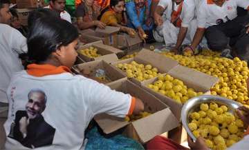 Delhi BJP to distribute one laddoo per family for standing in queues