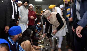 Prime Minister Narendra Modi serving langar at the Golden Temple